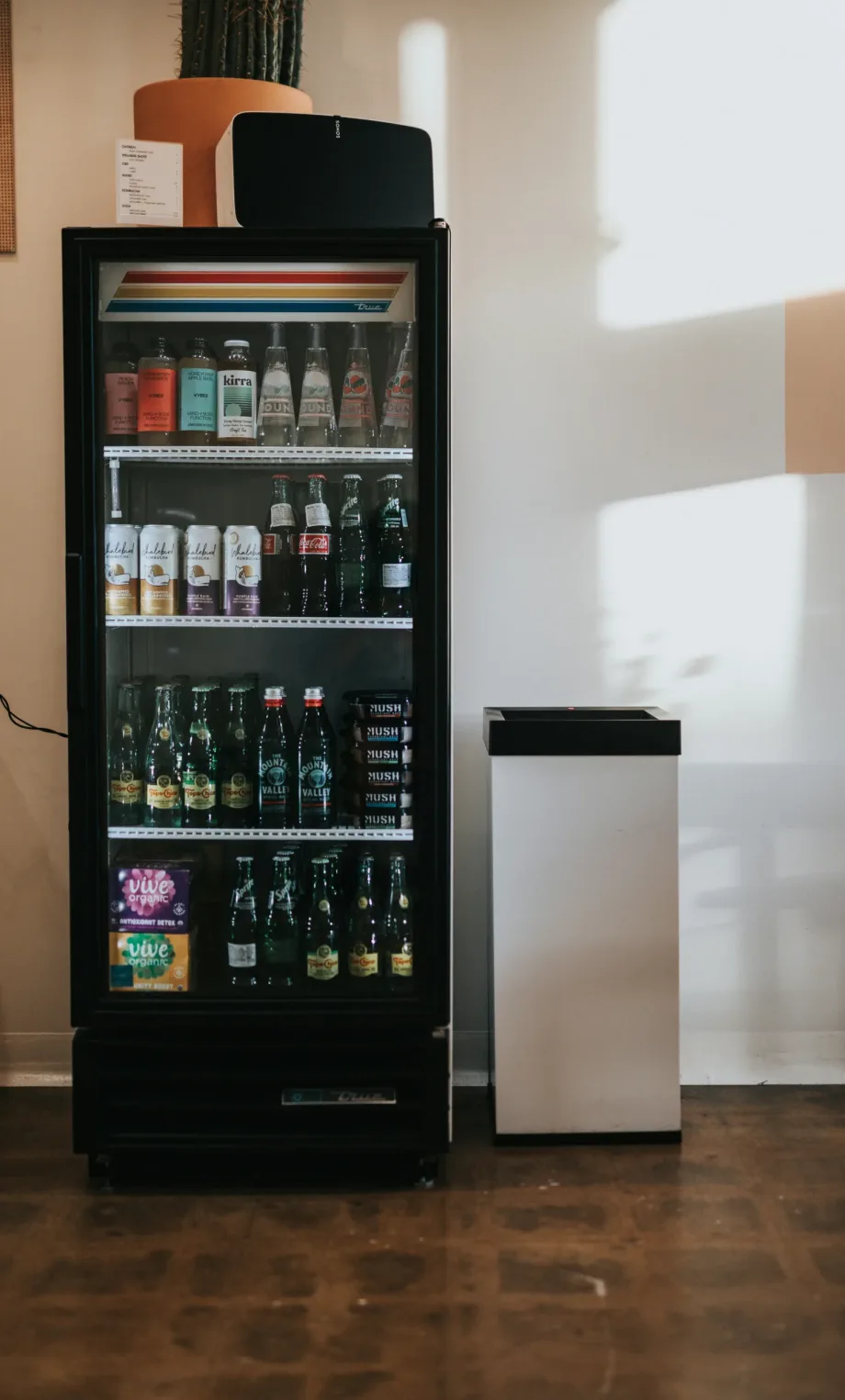 Commercial drink vending machine setup in restaurant or break area Single commercial vending machine placed in a restaurant or public space, stocked with beverages